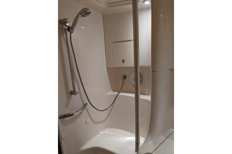 Slide: The Image of 2004 Sea Ray 380 Sundancer shower with modern fixtures and sleek design. - 25