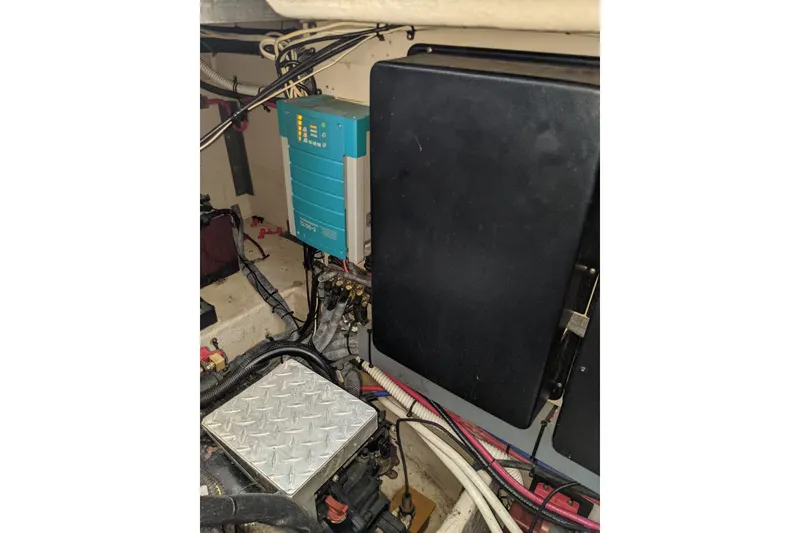 Slide: The Image of Engine room of 2004 Sea Ray 380 Sundancer with electrical components and wiring. - 29