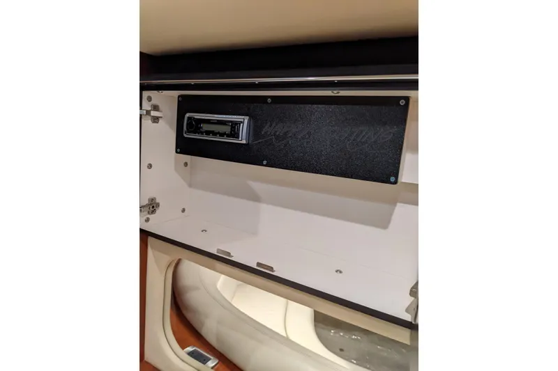 Slide: The Image of 2004 Sea Ray 380 Sundancer interior with stereo system in cabinet. - 30