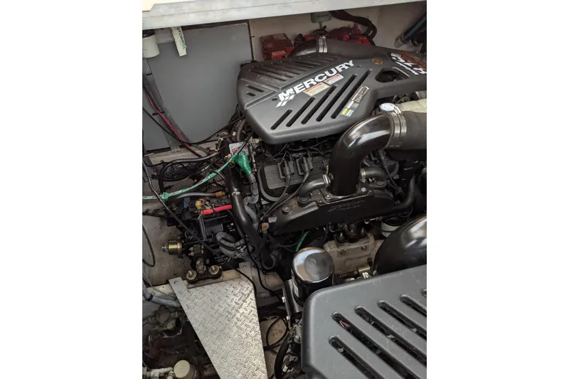 Slide: The Image of Engine compartment of a 2004 Sea Ray 380 Sundancer with Mercury components. - 34