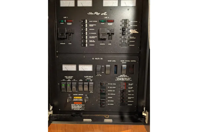 Slide: The Image of Electrical control panel of a 2004 Sea Ray 380 Sundancer boat. - 36
