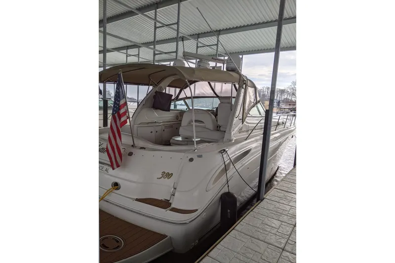 Slide: The Image of 2004 Sea Ray 380 Sundancer yacht docked under a covered marina. - 41