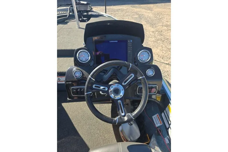 Slide: The Image of 2018 Nitro Z18 Tracker boat dashboard with steering wheel and gauges. - 6