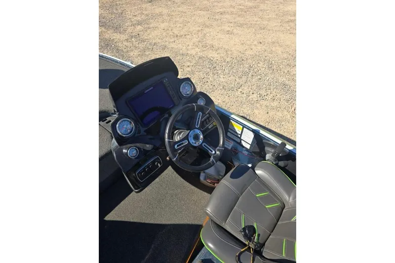 Slide: The Image of 2018 Nitro Z18 Tracker boat dashboard with steering wheel and gauges. - 7