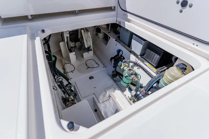 Slide: The Image of 2022 Pursuit S 378 Sport boat engine compartment with visible components and wiring. - 39