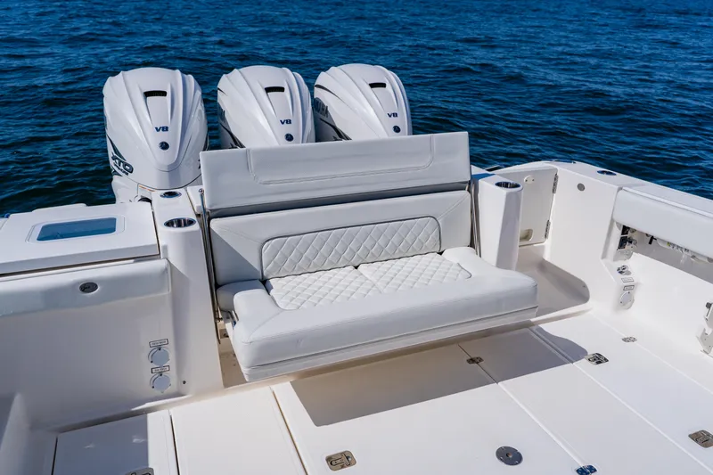 Slide: The Image of 2022 Pursuit S 378 Sport boat with triple V8 engines and luxurious seating. - 46