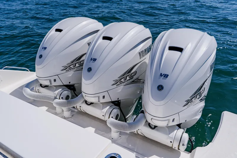 Slide: The Image of Triple Yamaha XTO outboard engines on a 2022 Pursuit S 378 Sport boat. - 50