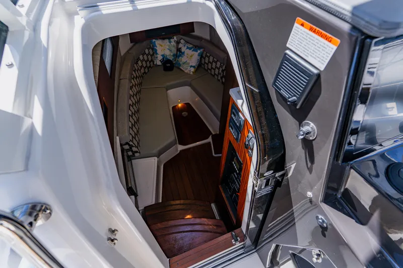 Slide: The Image of 2022 Pursuit S 378 Sport cabin interior with seating and wood accents. - 51