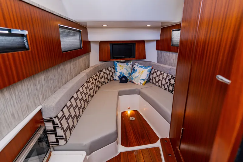 Slide: The Image of Luxurious interior of 2022 Pursuit S 378 Sport boat with cozy seating and modern decor. - 52