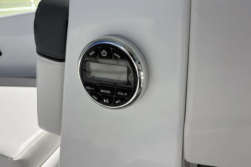Slide: The Image of Control panel on 2026 Tahoe T16 boat, featuring volume and mode buttons. - 10
