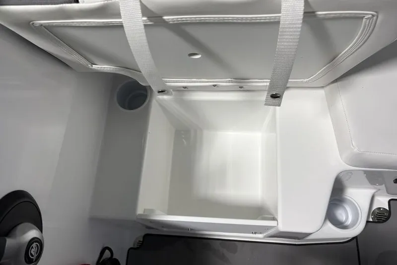 Slide: The Image of Interior storage compartment of 2026 Tahoe T16 boat with cup holder and strap. - 11