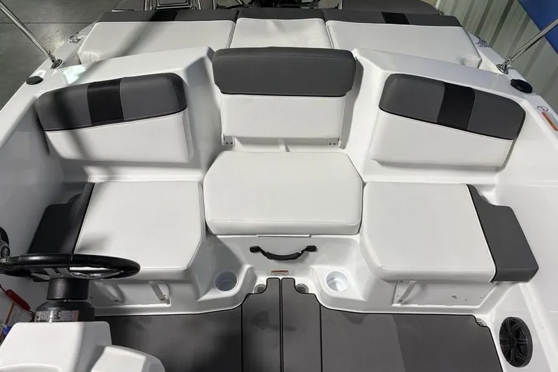 Slide: The Image of 2026 Tahoe T16 boat interior with gray and white seating arrangement. - 13