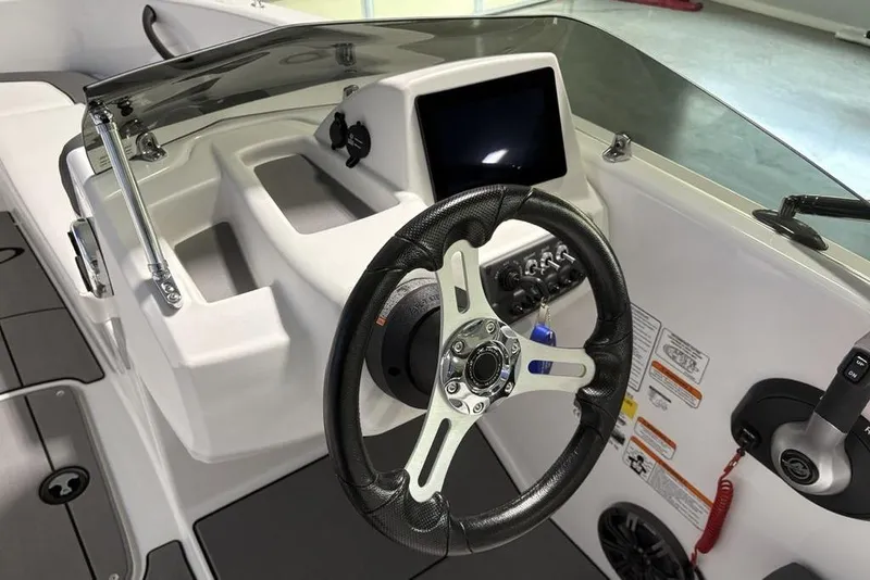 Slide: The Image of Steering console of 2026 Tahoe T16 boat with modern controls and display. - 15