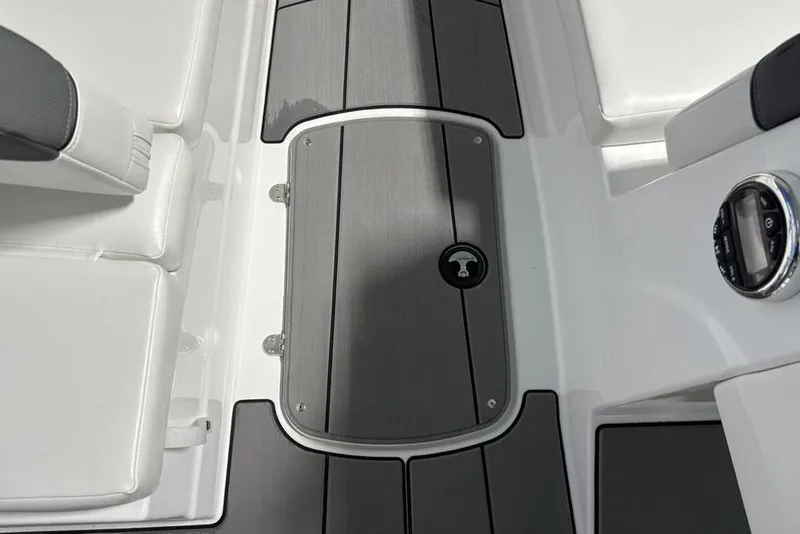 Slide: The Image of 2026 Tahoe T16 boat interior with sleek gray and white seating and flooring. - 5