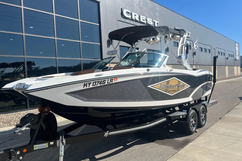 The Image of 2016 MasterCraft X23 boat on trailer outside Crest building. - 1