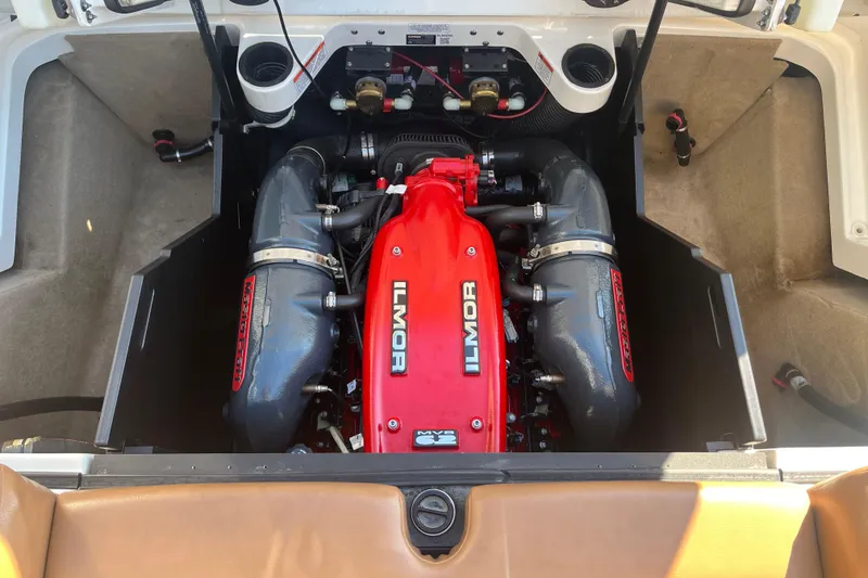 Slide: The Image of 2016 MasterCraft X23 engine compartment with Ilmor engine, showcasing performance components. - 18