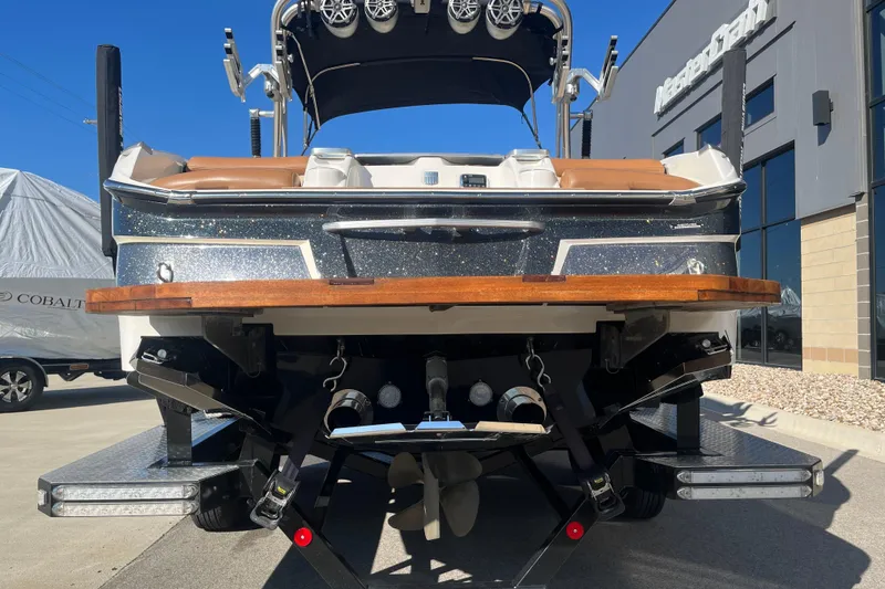 Slide: The Image of 2016 MasterCraft X23 boat rear view with speakers and swim platform. - 7