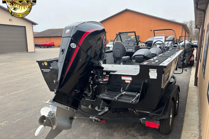Slide: The Image of 2026 Tracker Targa V-18 WT boat with powerful outboard motor, parked outdoors. - 3