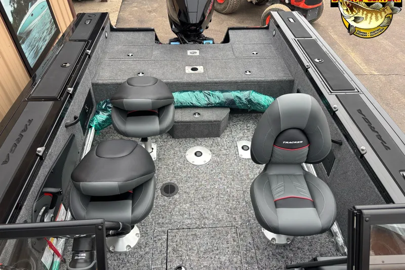 Slide: The Image of 2026 Tracker Targa V-18 WT boat interior with two swivel seats and carpeted flooring. - 5