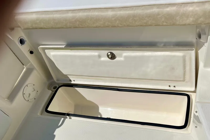 Slide: The Image of 2013 Seaswirl Striper 2601 Walkaround O/B storage compartment, open and empty. - 12