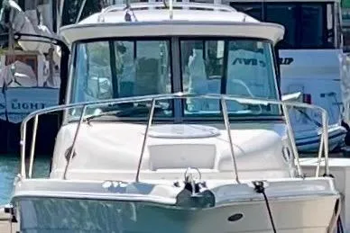 Slide: The Image of 2013 Seaswirl Striper 2601 Walkaround O/B boat docked in marina. - 14
