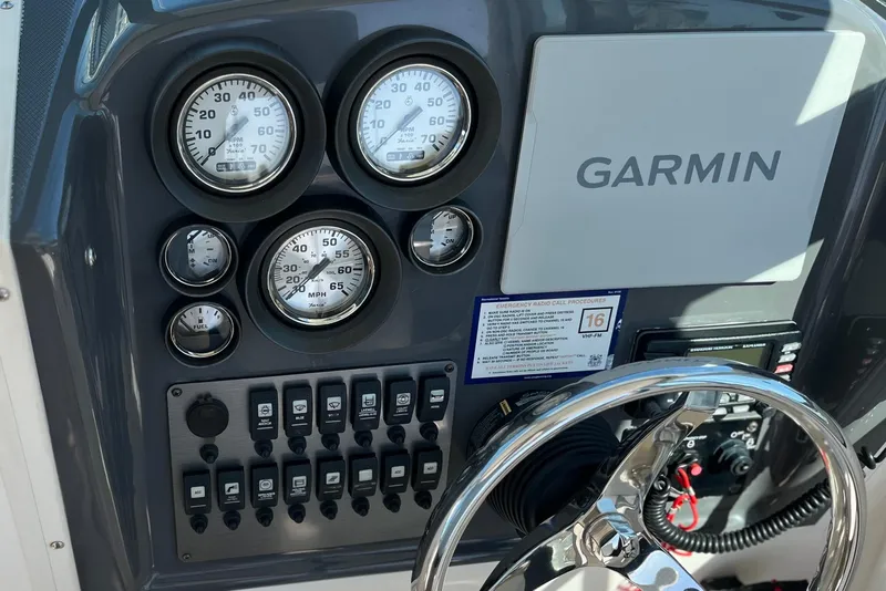Slide: The Image of Dashboard of 2013 Seaswirl Striper 2601 Walkaround O/B with Garmin navigation system. - 4