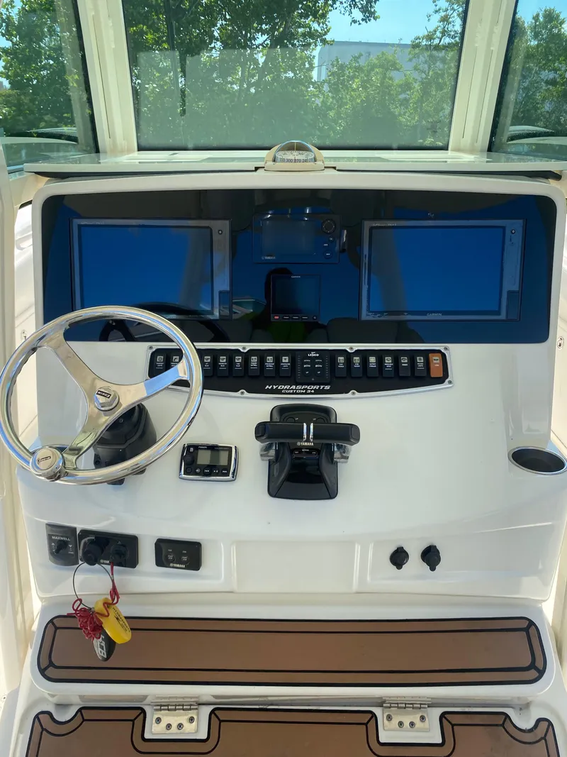 Slide: The Image of 2017 Hydra-Sports 3400 Center Console boat with dual engines and plush seating. - 10