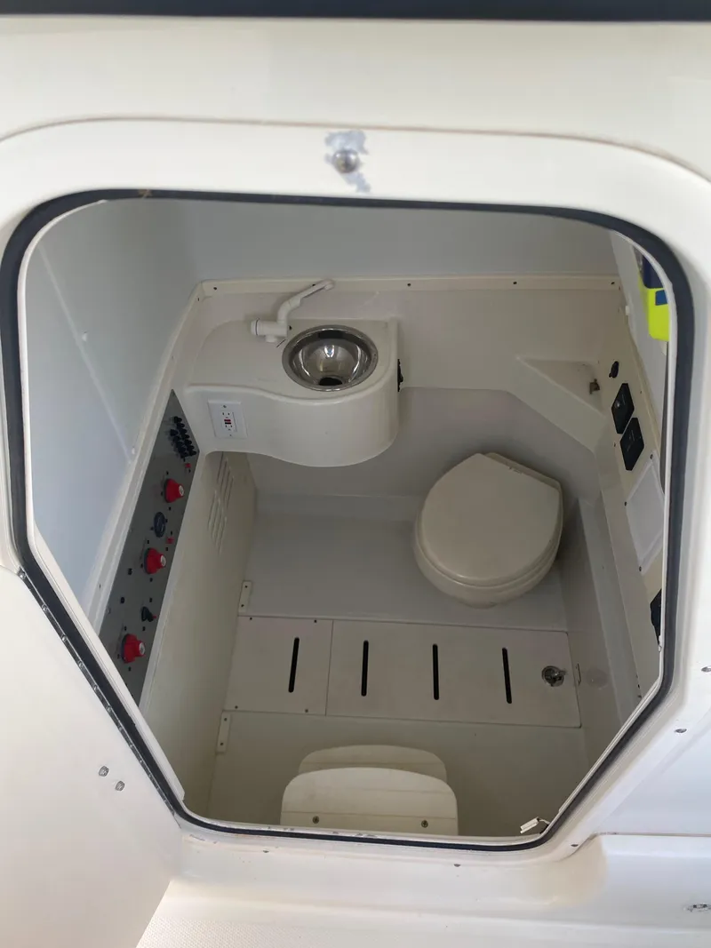 Slide: The Image of 2017 Hydra-Sports 3400 Center Console dashboard with navigation screens and controls. - 13