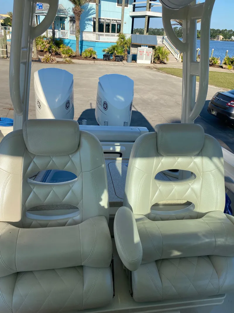 Slide: The Image of 2017 Hydra-Sports 3400 Center Console boat, side view, white interior, outdoor setting. - 9