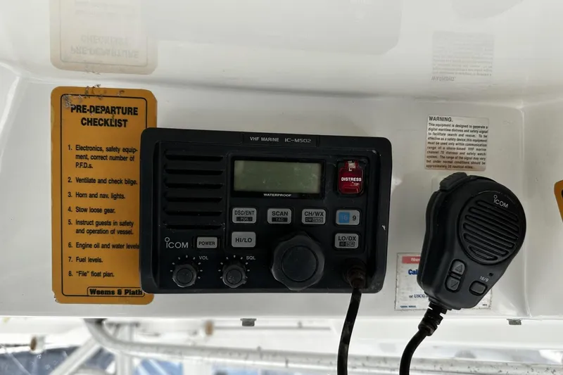 Slide: The Image of VHF marine radio and pre-departure checklist on 1997 Luhrs 32 Open boat. - 18