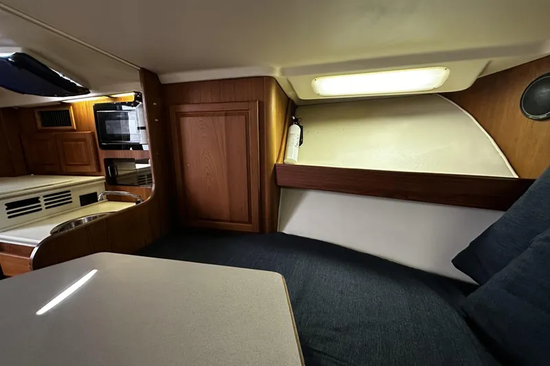 Slide: The Image of Interior of 1997 Luhrs 32 Open boat with cozy seating and kitchenette. - 30