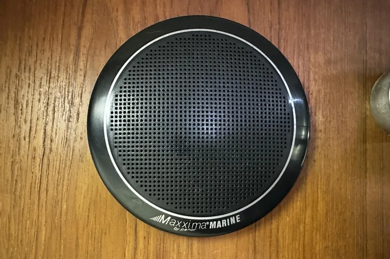 Slide: The Image of Maxxima Marine speaker on 1997 Luhrs 32 Open boat's wooden surface. - 38