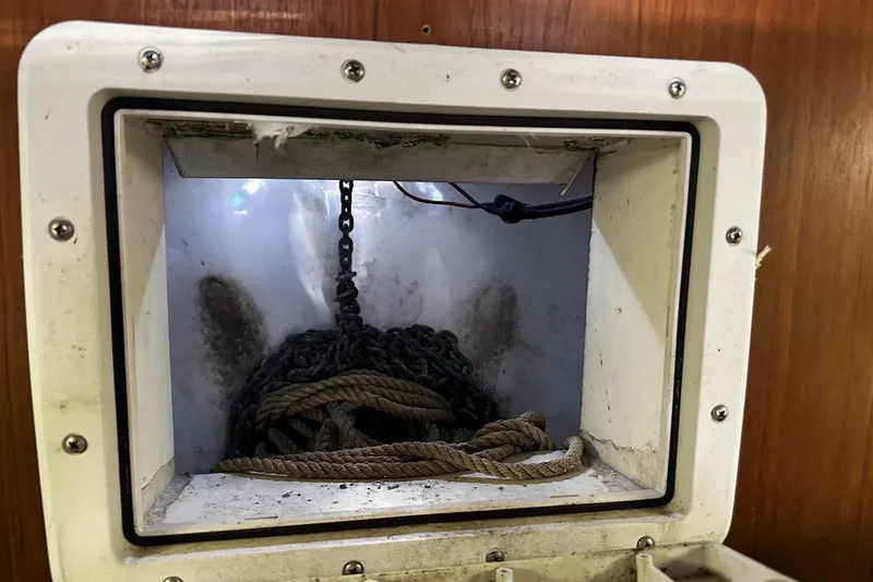 Slide: The Image of Anchor chain and rope storage in 1997 Luhrs 32 Open boat compartment. - 41