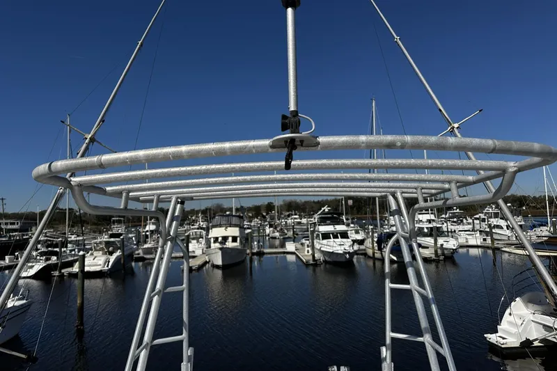 Slide: The Image of 1997 Luhrs 32 Open boat tower overlooking marina with multiple docked boats. - 52