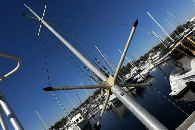 Slide: The Image of Antenna on 1997 Luhrs 32 Open boat in marina, clear blue sky background. - 53