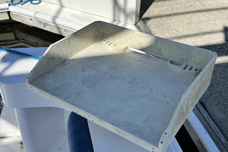 Slide: The Image of Cutting board on 1997 Luhrs 32 Open boat deck, with blue rope and scissors nearby. - 55