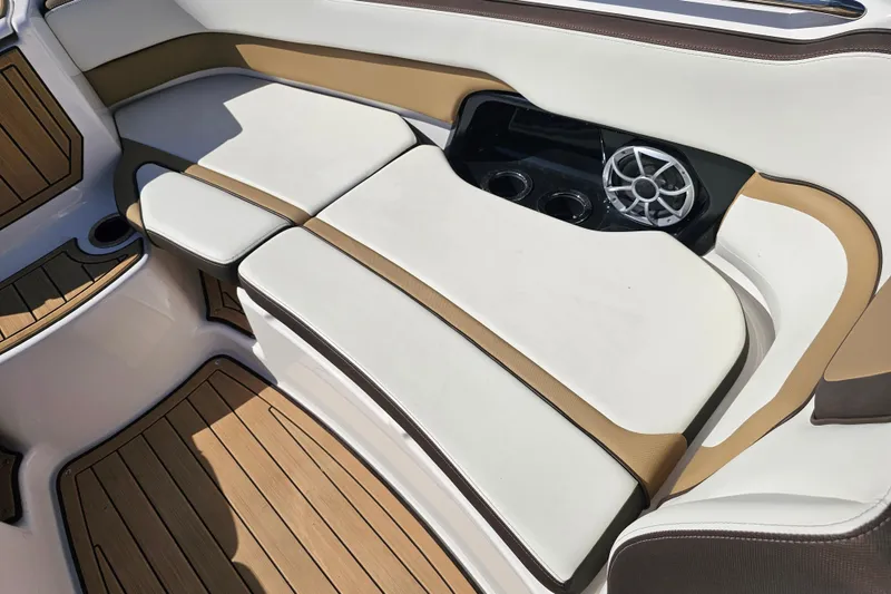 Slide: The Image of 2022 Yamaha Boats 252SD interior with cushioned seating and speaker system. - 13