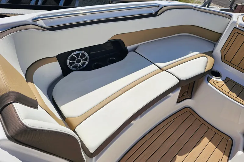 Slide: The Image of 2022 Yamaha Boats 252SD interior with cushioned seating and speaker system. - 14