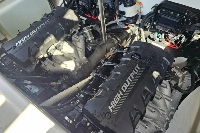Slide: The Image of 2022 Yamaha Boats 252SD high output engine compartment, showcasing dual engines and wiring. - 24