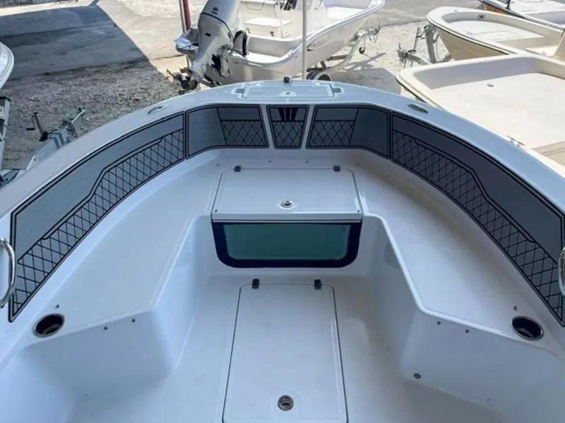 Slide: The Image of 2024 Wellcraft 202 Fisherman boat interior, featuring spacious seating and storage compartments. - 4