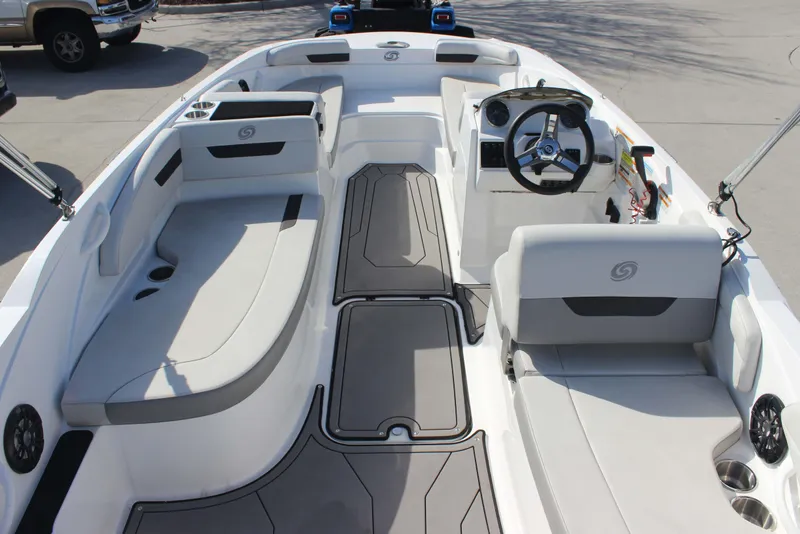 Slide: The Image of 2021 Hurricane SunDeck Sport 185 OB boat interior with seating and steering wheel. - 10