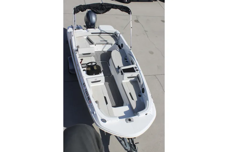 Slide: The Image of 2021 Hurricane SunDeck Sport 185 OB boat, white interior, spacious seating, and modern design. - 14