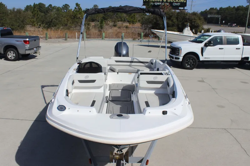 Slide: The Image of 2021 Hurricane SunDeck Sport 185 OB boat on trailer in parking lot. - 7