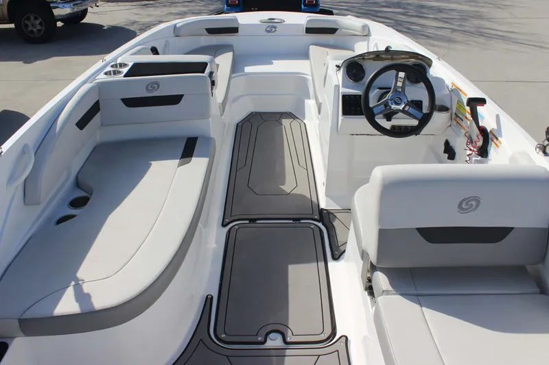 Slide: The Image of 2021 Hurricane SunDeck Sport 185 OB boat interior with seating and steering console. - 9