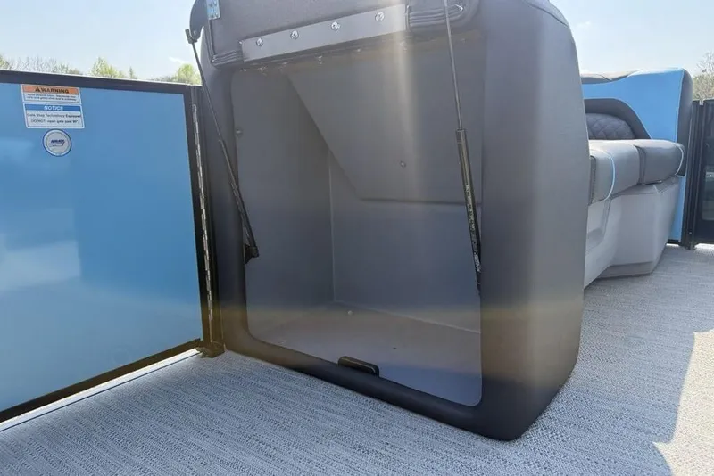 Slide: The Image of Open storage compartment on 2026 Godfrey Sweetwater 2286 SFL boat, showcasing interior space. - 16
