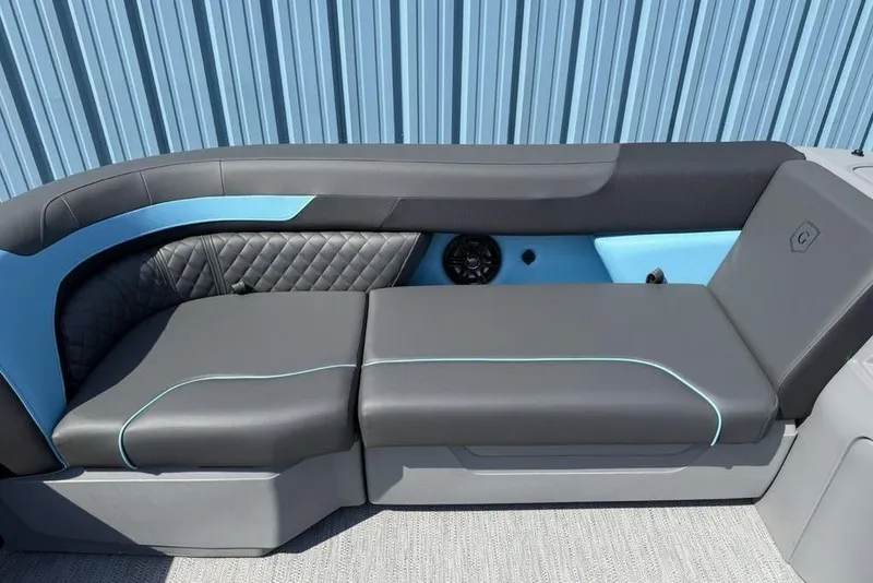 Slide: The Image of Luxurious seating on 2026 Godfrey Sweetwater 2286 SFL boat, featuring sleek design and blue accents. - 17