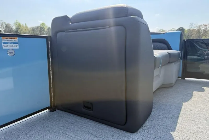 Slide: The Image of 2026 Godfrey Sweetwater 2286 SFL boat interior with seating and open gate. - 19