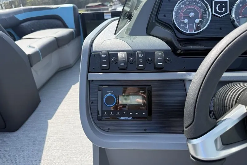 Slide: The Image of Dashboard of 2026 Godfrey Sweetwater 2286 SFL boat with controls and steering wheel. - 22