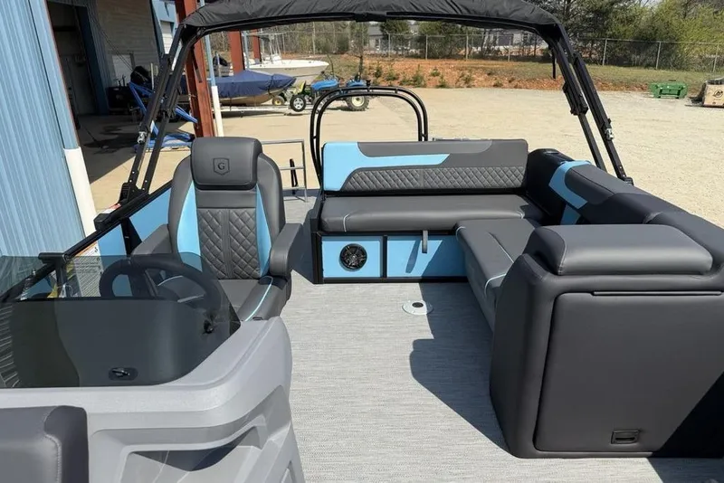 Slide: The Image of Interior of 2026 Godfrey Sweetwater 2286 SFL pontoon boat with modern seating and steering console. - 26