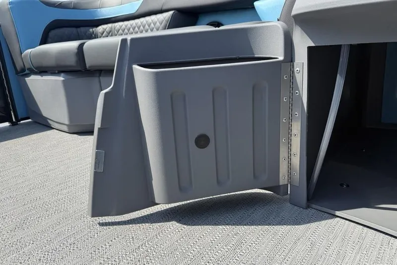 Slide: The Image of 2026 Godfrey Sweetwater 2286 SFL interior storage compartment with open door. - 27